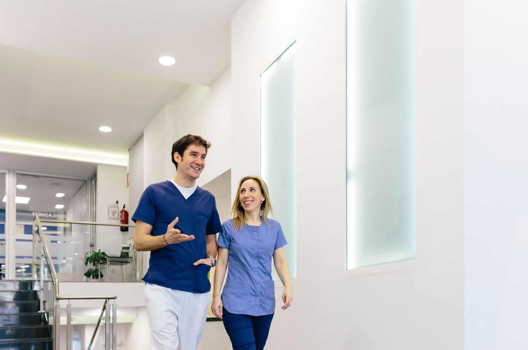 Medical Couple At Work In A Hospital Corridor